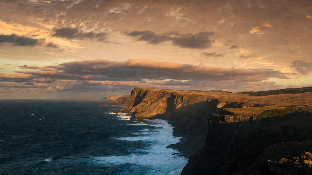 A Dramatic Cliff Overlooking The Ocean — Landscape