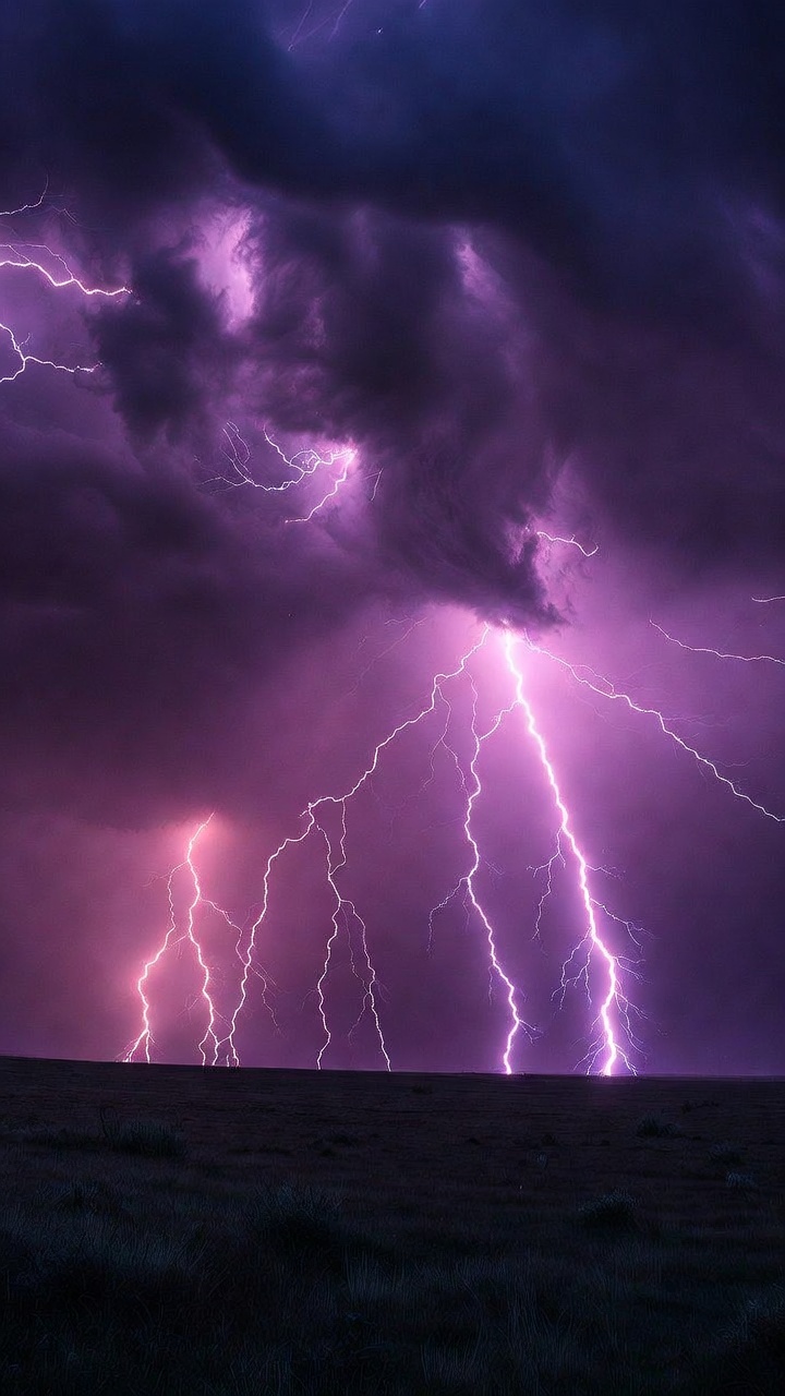Purple Lightning Storm Over Open Plains — Phone Wallpaper